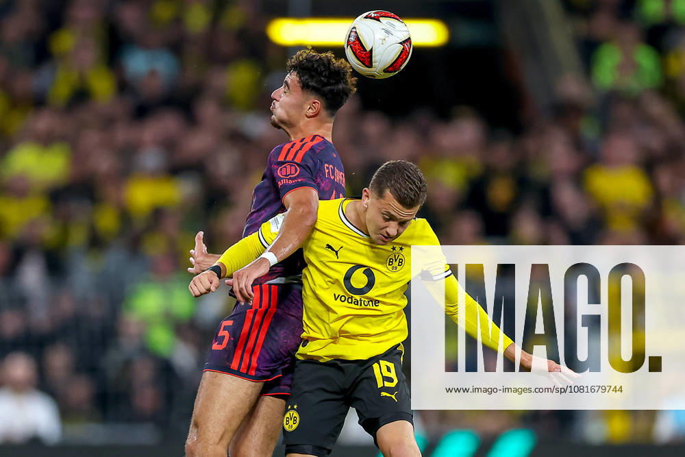 Fußball, Borussia Dortmund - FC Bayern München, Signal Iduna Park, Saison 2026 2027: Aleksandar Pavlovic (FC Bayern München 45) im Zweikampf gegen Konstantinos Karetsas (BVB 19) DFB regulations prohibit any use of photographs as image sequences and or quasi-video. Nordrhein-Westfalen Deutschland