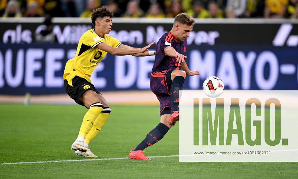 Fussball Supercup Saison 2026 2027 22.08.2026 Borussia Dortmund - FC Bayern Muenchen Samuele Inacio (li, Borussia Dortmund) gegen Joshua Kimmich (re, FC Bayern Muenchen)