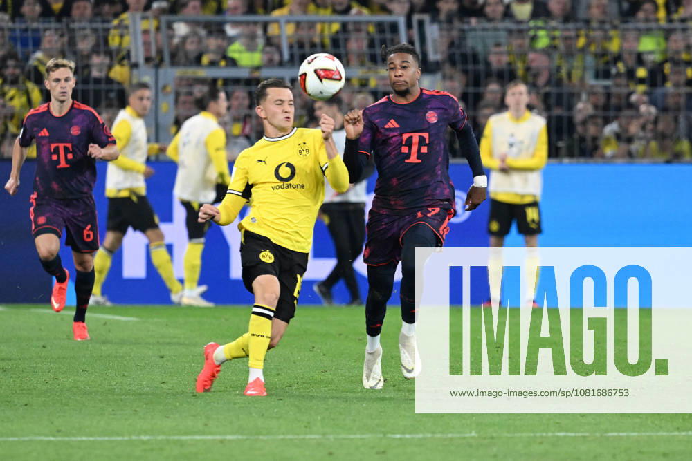 Fussball Franz Beckenbauer Supercup 2026, Borussia Dortmund - FC Bayern München v.l. Konstantinos Karetsas (Borussia Dortmund) Michael Olise (FC Bayern Muenchen) Zweikampf, Aktion, action, battle for the ball Dortmund