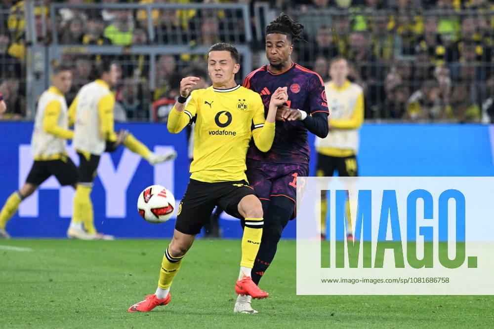 Fussball Franz Beckenbauer Supercup 2026, Borussia Dortmund - FC Bayern München v.l. Konstantinos Karetsas (Borussia Dortmund) Michael Olise (FC Bayern Muenchen) Zweikampf, Aktion, action, battle for the ball Dortmund