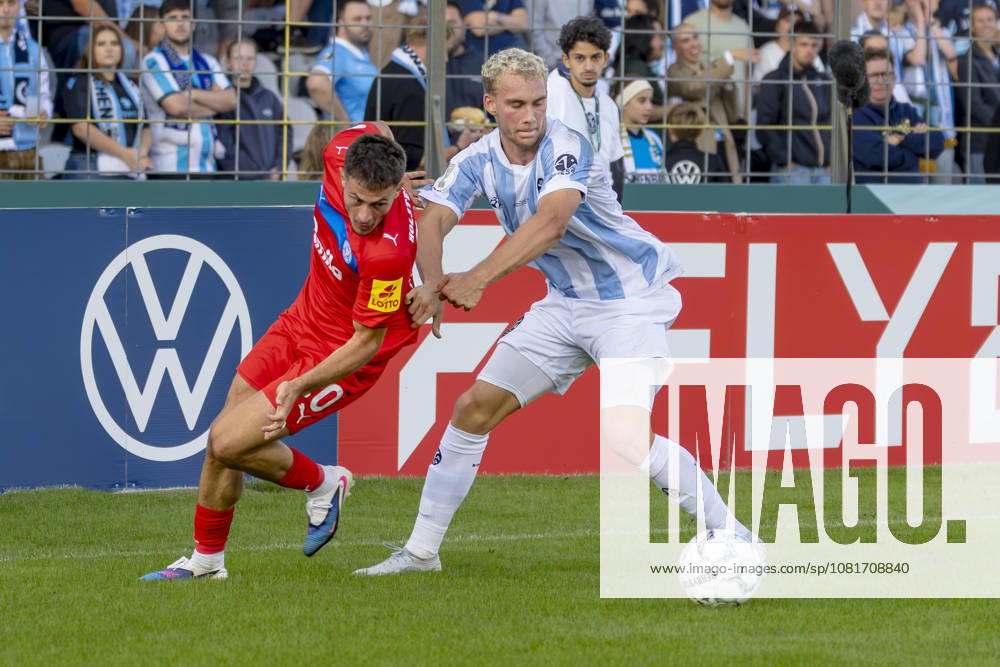 München, Deutschland 22. August 2026: DFB-Pokal - 2026 2027 - 1. Runde - TSV 1860 München gegen Holstein Kiel Im Bild: v. li. im Zweikampf Adrian Kapralik (Kiel) und Lasse Faßmann Fassmann (TSV) DFB DFL regulations prohibit any use of photographs as image sequences and or quasi-video Grünwalder Stadion Bayern