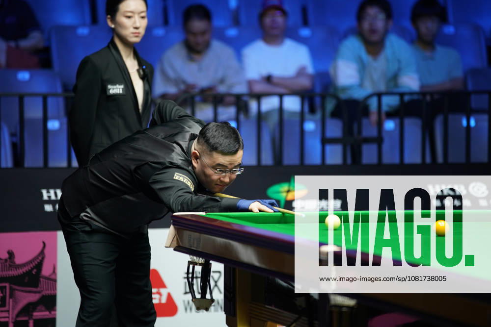 Guan Zhen of China plays a shot in the first round match against Gao Yang of China on day 1 of Wuhan Open 2026 at the Optics Valley Gymnasium of Huazhong University of Science and Technology on August 23, 2026 in Wuhan, Hubei Province of China.