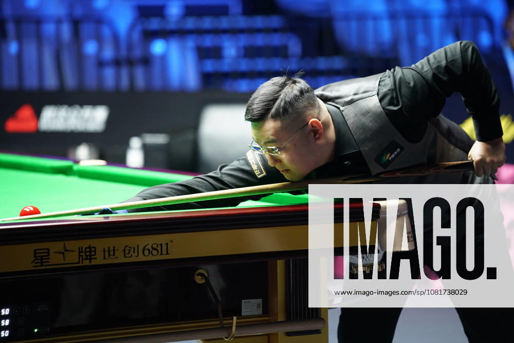 Guan Zhen of China plays a shot in the first round match against Gao Yang of China on day 1 of Wuhan Open 2026 at the Optics Valley Gymnasium of Huazhong University of Science and Technology on August 23, 2026 in Wuhan, Hubei Province of China.