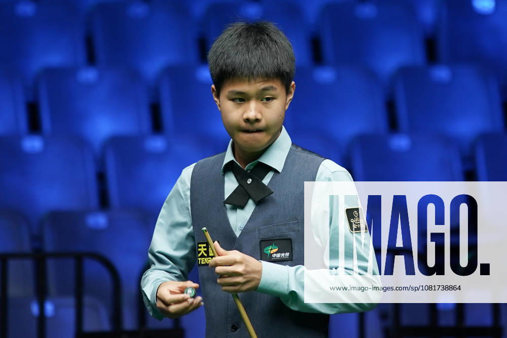 Wang Xinzhong of China chalks the cue in the first round match against Ben Mertens of Belgium on day 1 of Wuhan Open 2026 at the Optics Valley Gymnasium of Huazhong University of Science and Technology on August 23, 2026 in Wuhan, Hubei Province of China.