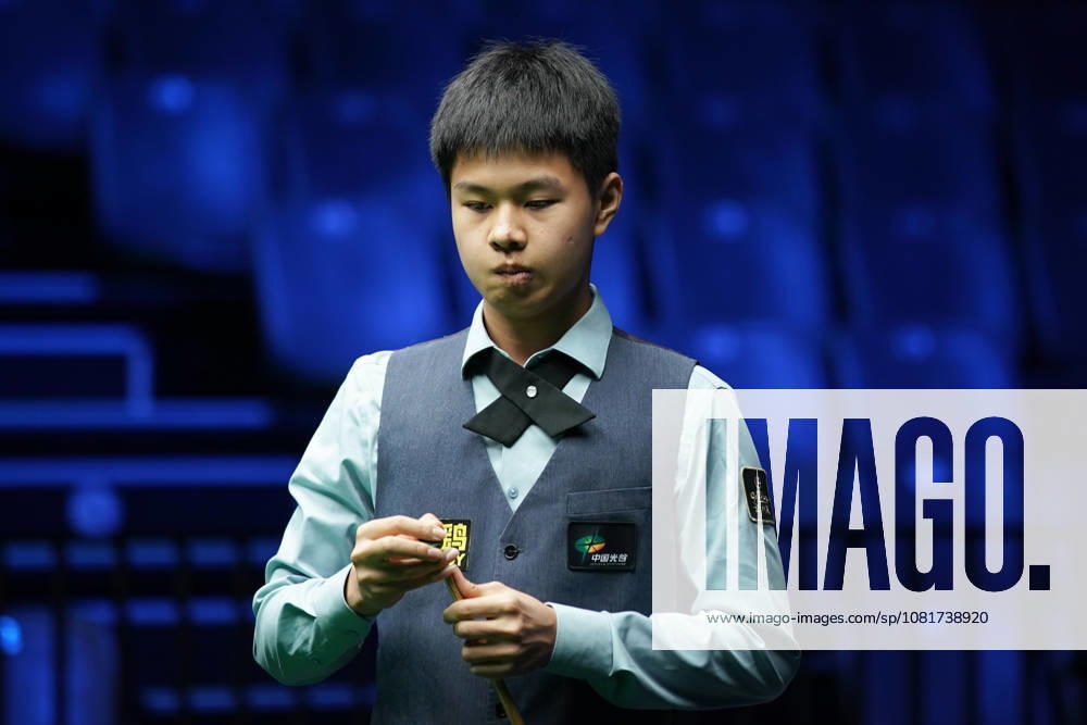 Wang Xinzhong of China chalks the cue in the first round match against Ben Mertens of Belgium on day 1 of Wuhan Open 2026 at the Optics Valley Gymnasium of Huazhong University of Science and Technology on August 23, 2026 in Wuhan, Hubei Province of China.
