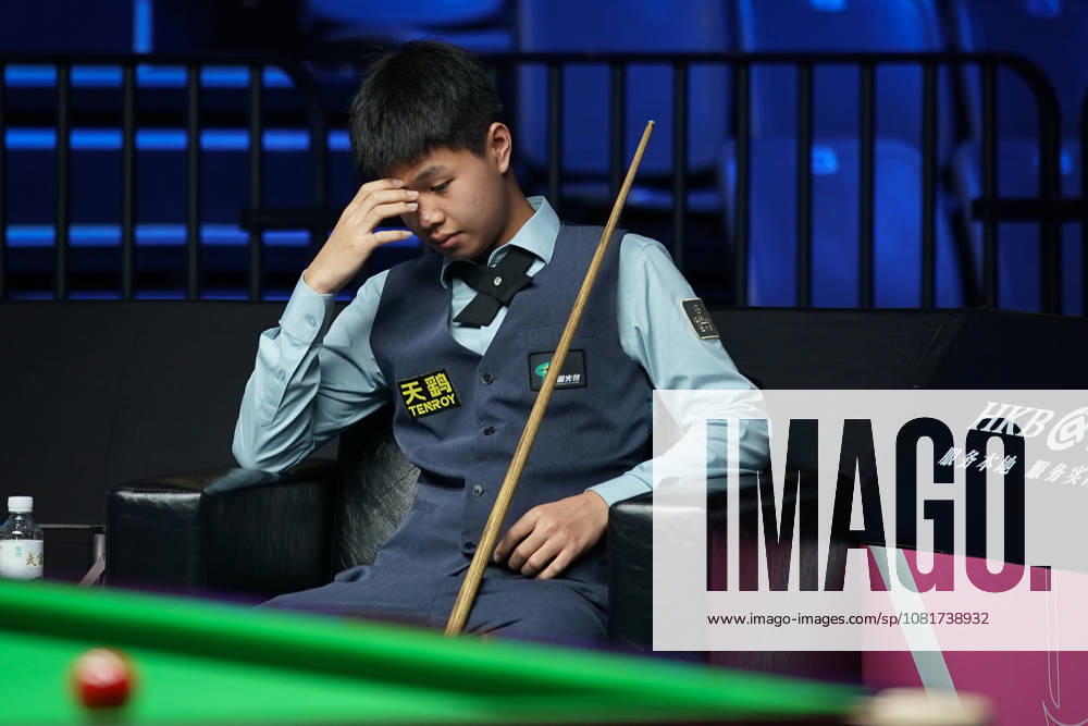 Wang Xinzhong of China reacts in the first round match against Ben Mertens of Belgium on day 1 of Wuhan Open 2026 at the Optics Valley Gymnasium of Huazhong University of Science and Technology on August 23, 2026 in Wuhan, Hubei Province of China.