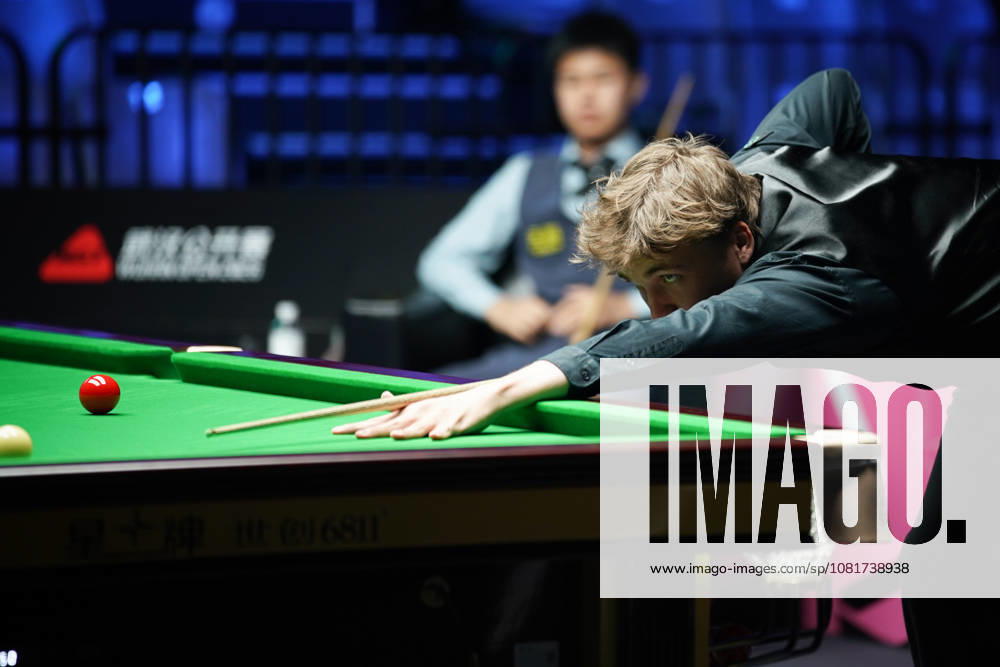 Ben Mertens of Belgium plays a shot in the first round match against Wang Xinzhong of China on day 1 of Wuhan Open 2026 at the Optics Valley Gymnasium of Huazhong University of Science and Technology on August 23, 2026 in Wuhan, Hubei Province of China.