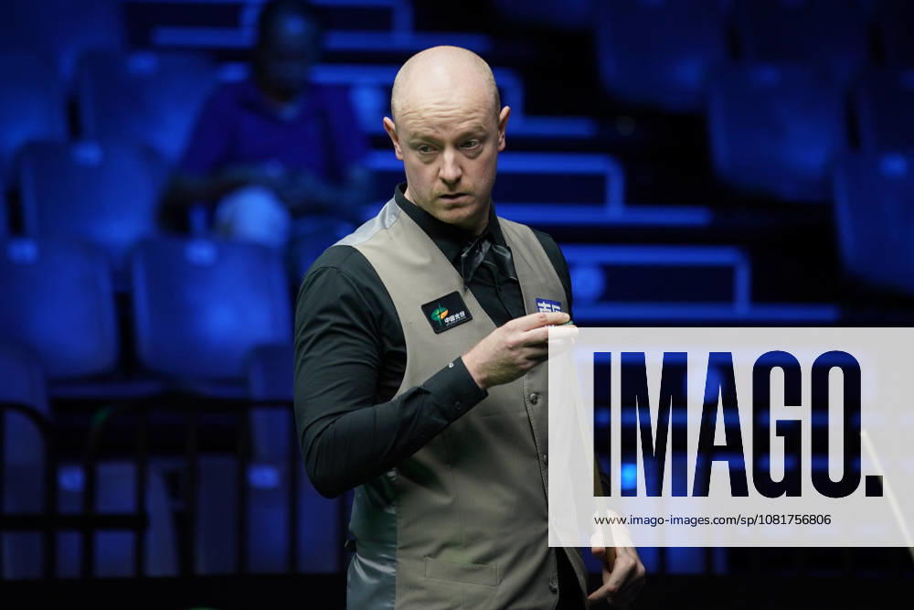 Chris Wakelin of England chalks the cue in the first round match against Jordan Brown of Northern Ireland on day 1 of Wuhan Open 2026 at the Optics Valley Gymnasium of Huazhong University of Science and Technology on August 23, 2026 in Wuhan, Hubei Province of China.