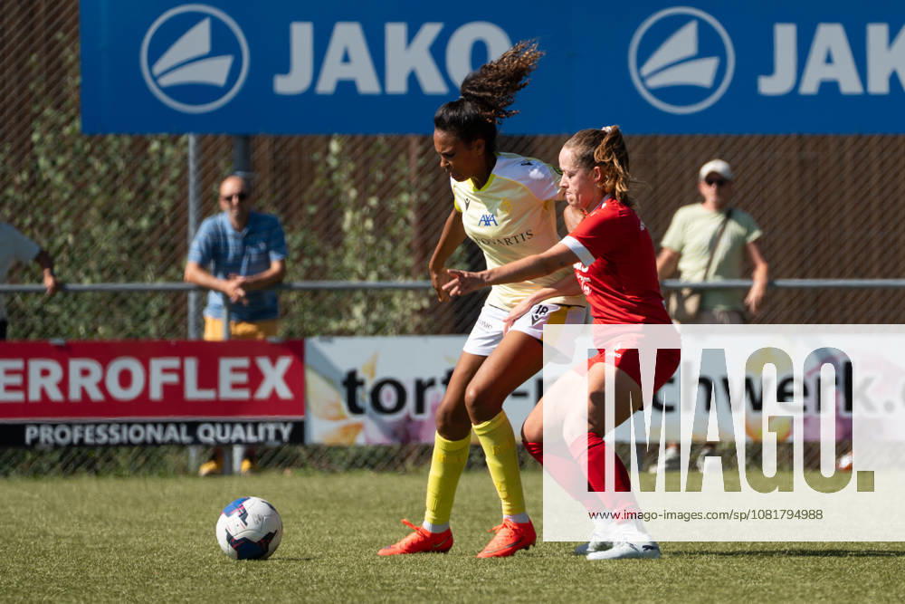 DÜDINGEN, FRIBOURG - AUGUST 23: Coumba Louisa Sow of FC Basel 1893 keeps possession against Martina Suter of SC Düdingen during the AXA Women?s Swiss Cup match between SC Düdingen and FC Basel 1893 at FKB Stadion Birchhölzli on August 23, 2026 in Düdingen, Fribourg, Switzerland.