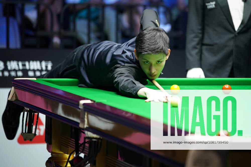 Wang Xinbo of China plays a shot during his match against Xiao Guodong of China in the round of 64 at the 2026 Wuhan Open on August 23, 2026 in Wuhan, Hubei Province of China. Xiao defeated Wang 5-0 to advance to the round of 32.