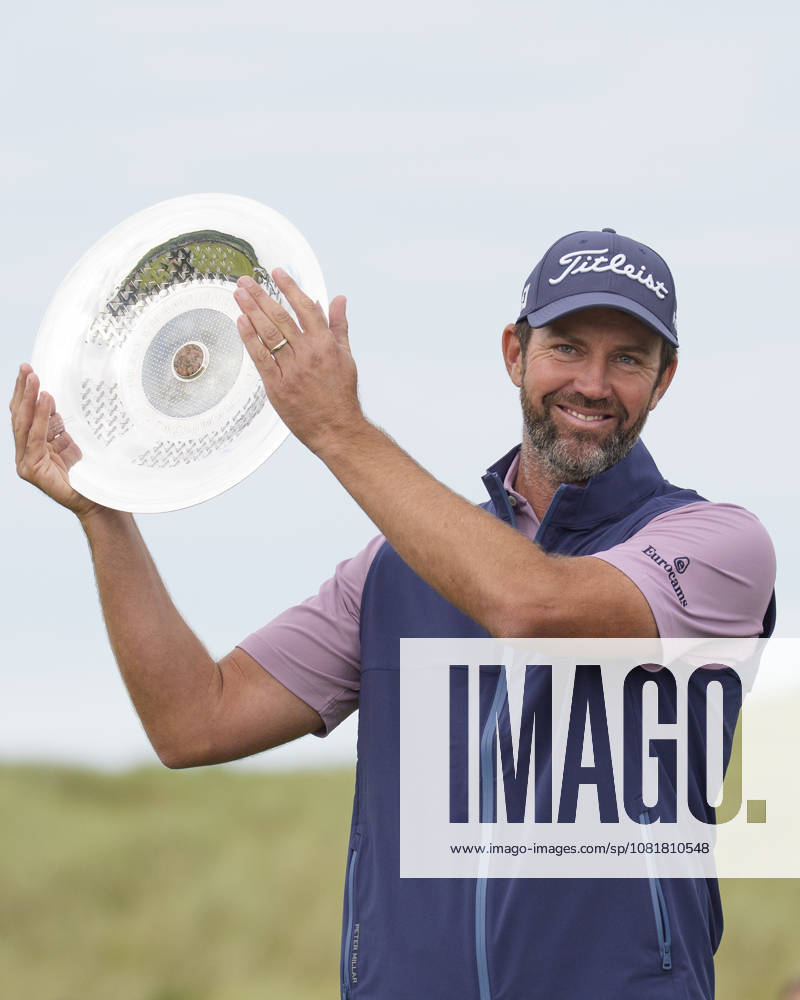 BALMEDIE, SCOTLAND - AUG 23: Scott Jamieson (SCO) hold the trophy aloft after winning The Nexo Championship during Round 4 at the 2026 Nexo Championship at the Trump International Golf Links, Balmedie on August 23, 2026 in Aberdeenshire, Scotland The 2026 Nexo Championship