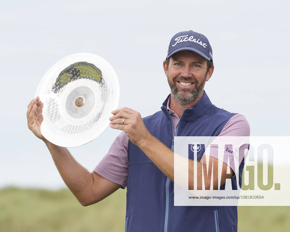 BALMEDIE, SCOTLAND - AUG 23: Scott Jamieson (SCO) hold the trophy aloft after winning The Nexo Championship during Round 4 at the 2026 Nexo Championship at the Trump International Golf Links, Balmedie on August 23, 2026 in Aberdeenshire, Scotland The 2026 Nexo Championship