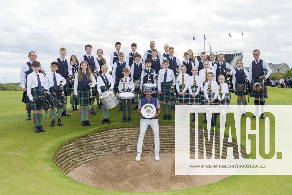 BALMEDIE, SCOTLAND - AUG 23: Scott Jamieson (SCO) holds the Nexo Trophy with the Robert Gordon Academy Pipe band after Round 4 at the 2026 Nexo Championship at the Trump International Golf Links, Balmedie on August 23, 2026 in Aberdeenshire, Scotland The 2026 Nexo Championship