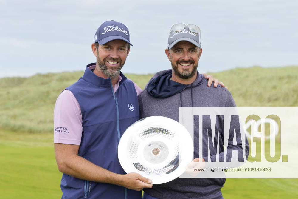 BALMEDIE, SCOTLAND - AUG 23: Scott Jamieson (SCO) holds the Nexo Trophy with his caddie after Round 4 at the 2026 Nexo Championship at the Trump International Golf Links, Balmedie on August 23, 2026 in Aberdeenshire, Scotland The 2026 Nexo Championship