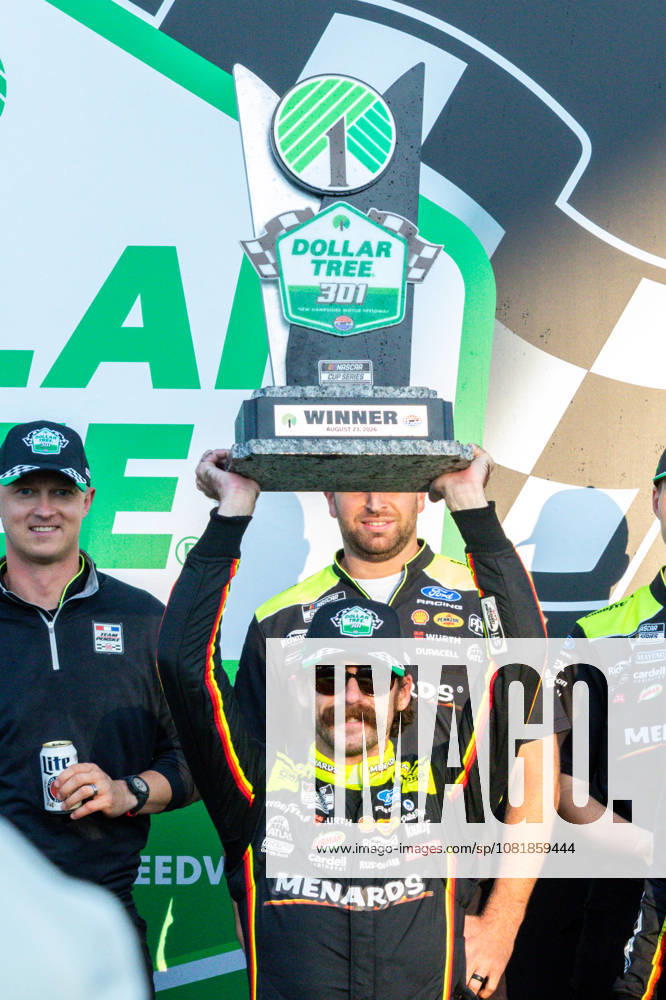 LOUDON, NH - AUGUST 23: Ryan Blaney ( 12 Team Penske Menards Dutch Boy Ford) hoists the trophy after winning the NASCAR, Motorsport, USA Cup Series Dollar Tree 301 on August 23, 2026, at New Hampshire Motor Speedway in Loudon, NH. (Photo by David Hahn Icon Sportswire) AUTO: AUG 23 NASCAR Cup Series Dollar Tree 301 Icon260823023