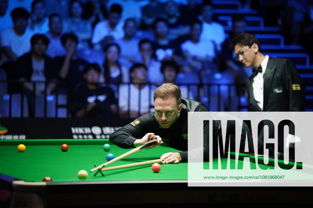 Judd Trump of England plays a shot in the first round match against Florian Nuessle of Austria on day 1 of Wuhan Open 2026 at the Optics Valley Gymnasium of Huazhong University of Science and Technology on August 23, 2026 in Wuhan, Hubei Province of China.