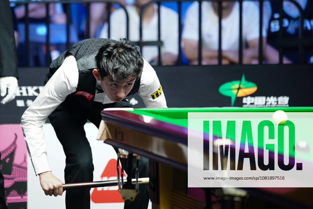 Wu Yize of China plays a shot in the second round match against Artemijs Zizins of Latvia on day 2 of Wuhan Open 2026 at the Optics Valley Gymnasium of Huazhong University of Science and Technology on August 24, 2026 in Wuhan, Hubei Province of China.