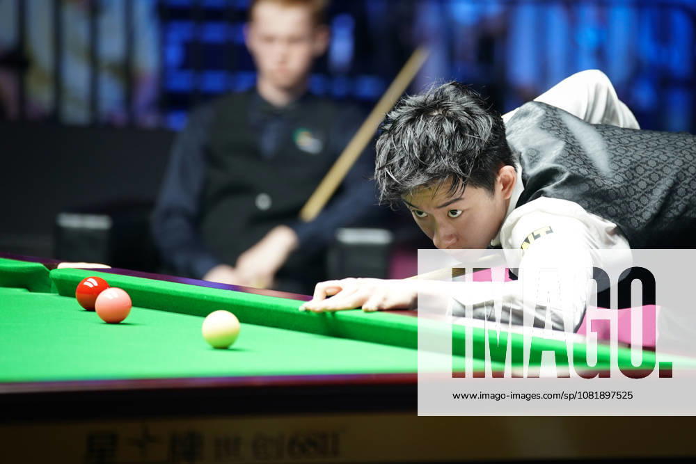 Wu Yize of China plays a shot in the second round match against Artemijs Zizins of Latvia on day 2 of Wuhan Open 2026 at the Optics Valley Gymnasium of Huazhong University of Science and Technology on August 24, 2026 in Wuhan, Hubei Province of China.