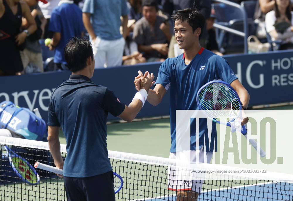 Kei Nishikori of Japan meets Rei Sakamoto of Japan at net after his straight sets defeat in a qualifying final round match at the 2026 US Open Tennis Championship at the USTA Billie Jean King National Tennis Center in New York City on Friday, August 28, 2026. This was Nishikori s final Grand Slam appearance. NYP20260828136 JOHNxANGELILLO