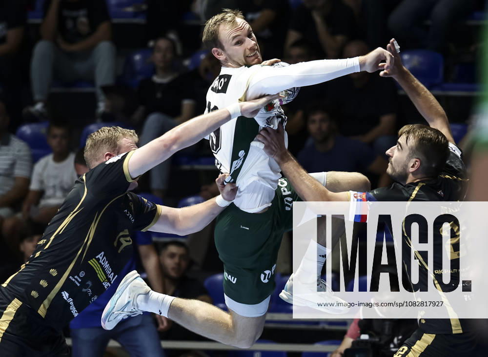 Partizan v Fuchse Berlin - EHF Champions League Mathias Gidsel (C) of Fuchse Berlin in action against Ivan Micic (R) and Sergei Ivanov (L) of Partizan during the EHF Champions League Season 2026 2027 Group Phase match between RK Partizan v Fuchse Berlin at Aleksandar Nikolic Hall on September 10, 2026 in Belgrade, Serbia. Belgrade Serbia