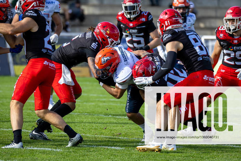 Tye Germain (ifm Razorbacks Ravensburg, 04 Running Back) tackled by Joshua Wünsch (Potsdam Royals, 42 Linebacker) and Devin Hembry (Potsdam Royals, 06 Defensive Back) Potsdam Royals vs ifm Razorbacks Ravensburg, American Football, German Football League, Week 19, 2026, 12.09.2026, Potsdam Sportpark Luftschiffhafen Brandenburg Germany
