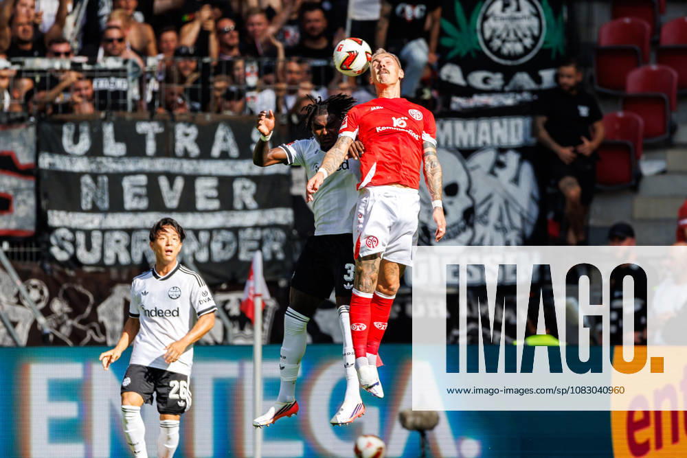 Lilian Brassier (Eintracht Frankfurt, 3) and Nadiem Amiri (1. FSV Mainz 05, 10) compete for the ball in the air during the Bundesliga match between 1. FSV Mainz 05 vs. Eintracht Frankfurt at MEWA Arena on matchday 3 of the 1. Bundesliga on September 12, 2026 in Mainz, Germany. DFL REGULATIONS PROHIBIT ANY USE OF PHOTOGRAPHS AS IMAGE SEQUENCES AND OR QUASI-VIDEO. Rhineland-Palatinate Germany