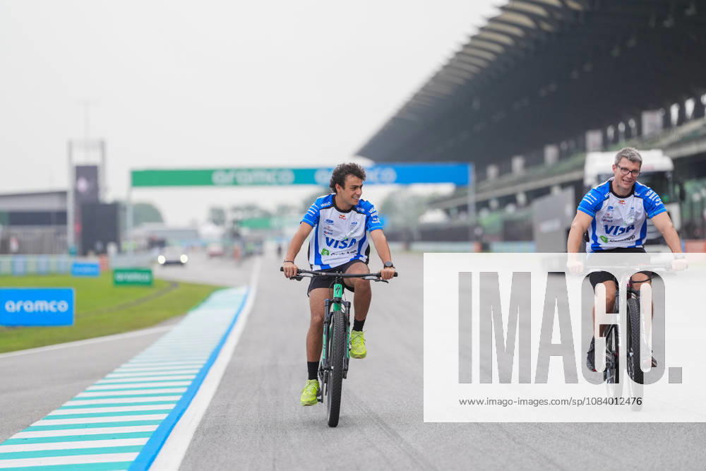 Arvid Lindblad of Great Britain and Visa Cash App Racing Bulls Formula 1 Team rides his bicycle on track during previews ahead of the FIA Formula 1 Grand Prix of Bahrain in Malaysia at the Sepang Circuit on October 01, 2026 in Kuala Lumpur, Malaysia. (Photo by Qian Jun SPP-Paddocker)