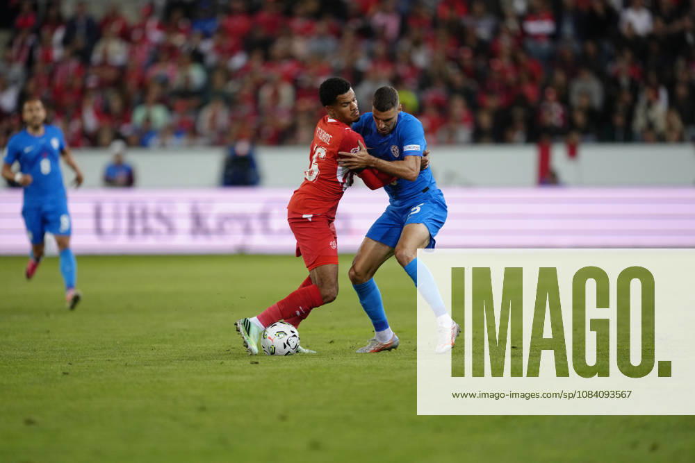 Zachary Athekame (16 SUI) against Danijel Sturm (15 SLO) during the UEFA Nations League match between Switzerland and Slovenia at thermoplan arena on October 03, 2026 in Luzern, Switzerland.