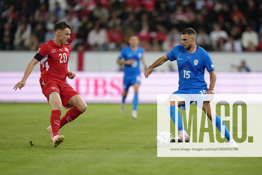Danijel Sturm (15 SLO) against Michel Aebischer (20 SUI) during the UEFA Nations League match between Switzerland and Slovenia at thermoplan arena on October 03, 2026 in Luzern, Switzerland.