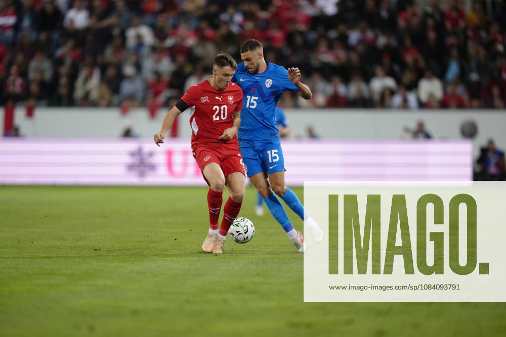 Danijel Sturm (15 SLO) against Michel Aebischer (20 SUI) during the UEFA Nations League match between Switzerland and Slovenia at thermoplan arena on October 03, 2026 in Luzern, Switzerland.
