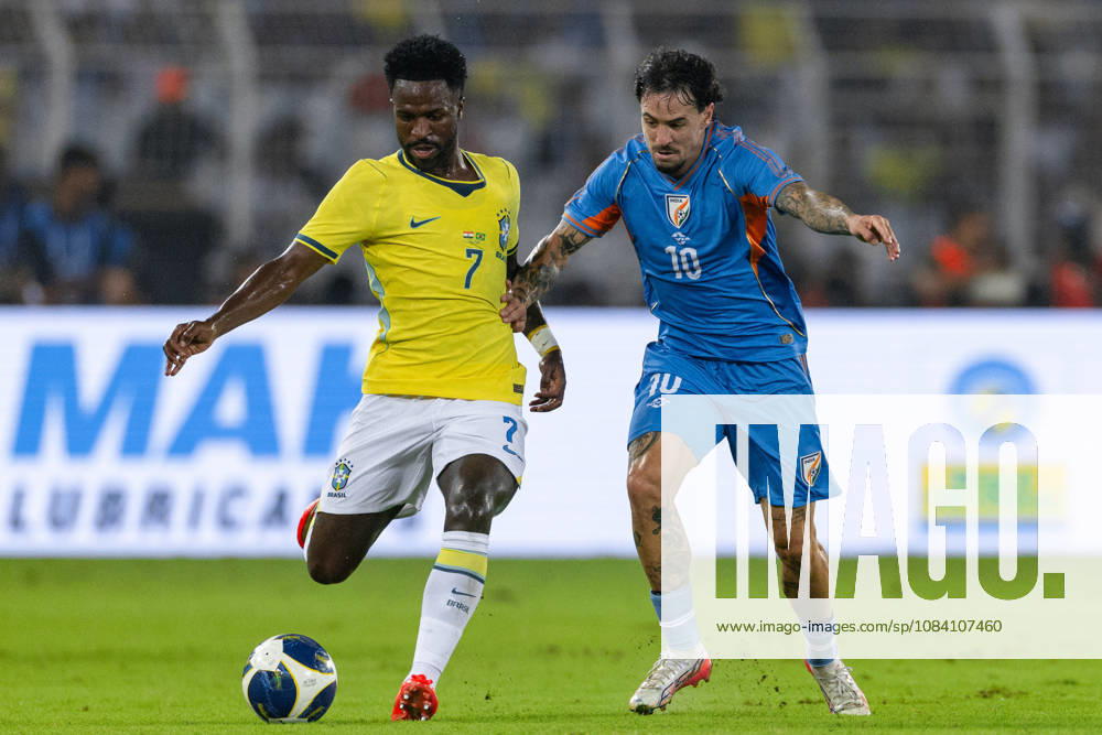 Vinicius Junior of Brazil and Ryan Williams of India duel for the ball during friendly match between India and Brazil at the Vivekananda Yuba Bharati Krirangan (VYBK) Stadium in Kolkata, India on 3rd October, 2026