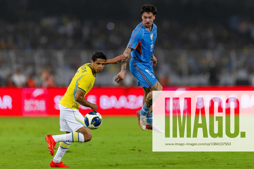 Ryan Williams of India and Douglas dos Santos Justino de Melo of Brazil duel for the ball during friendly match between India and Brazil at the Vivekananda Yuba Bharati Krirangan (VYBK) Stadium in Kolkata, India on 3rd October, 2026