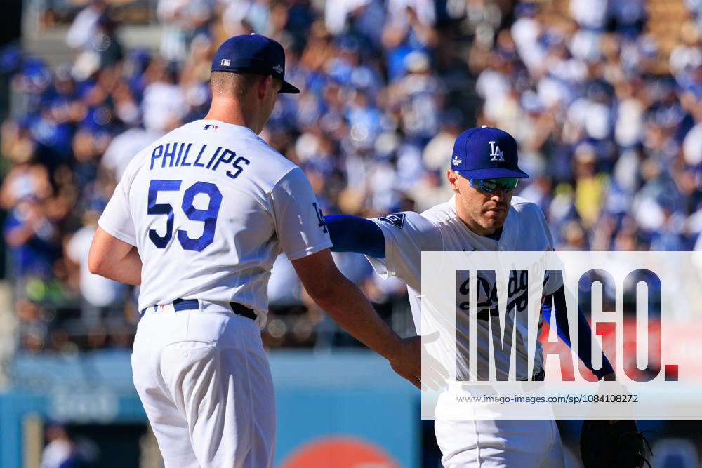 Closer Evan Phillips 59 of the Los Angeles Dodgers is congratulated by Freddie Freeman 5 after winning a NLDS Game 1 against the Atlanta Braves on Saturday October 3, 2026 at Dodger Stadium in Los Angeles, California. JAVIER ROJAS PI Los Angeles USA - ZUMAp124 20261003_zaa_p124_022