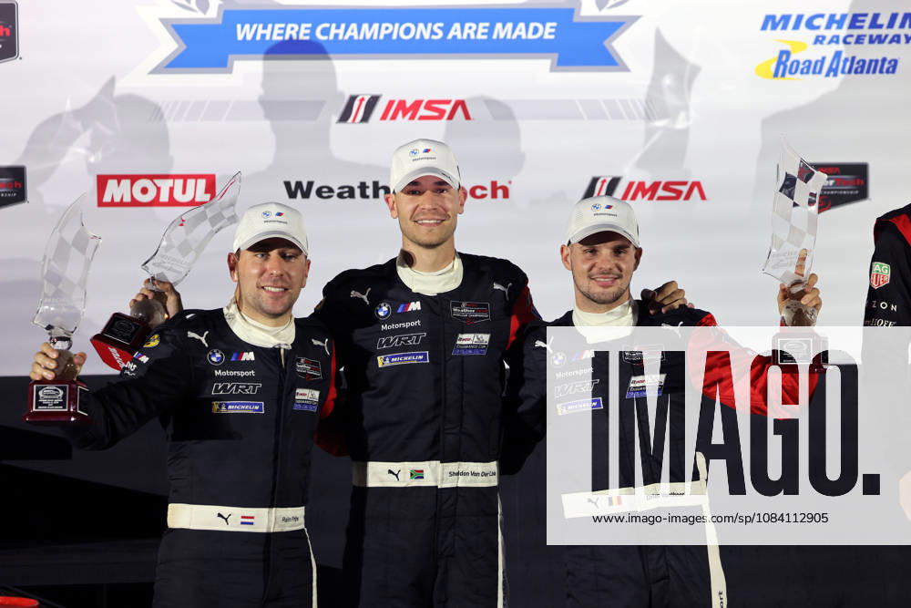 Robin Frjins (NED), Sheldon van der Linde (RSA), Dries Vanthoor (BEL) BMW M Hybrid V8 24 als zweiter mit Pokalen auf dem Podium, Siegerehrung, IMSA Rennserie, 29. Motul Petit le Mans Rennen, Road Atlanta, Georgia, USA, 03.10.2026, 10 Stunden Rennen