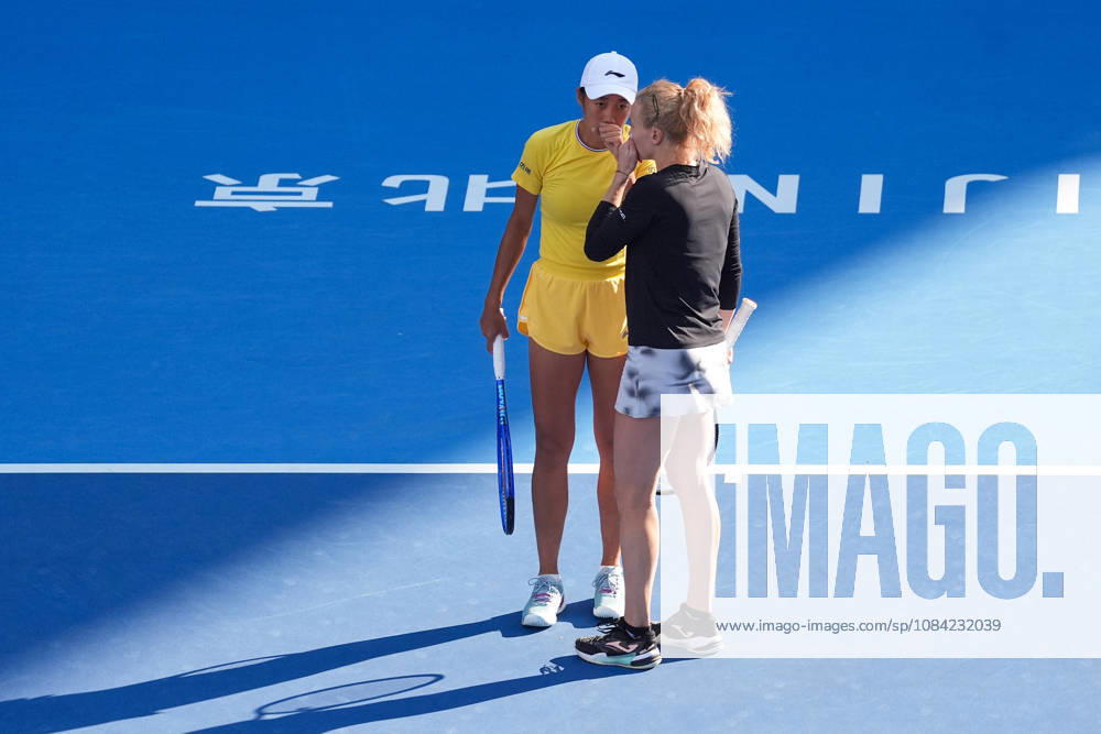 (261007) -- BEIJING, Oct. 7, 2026 -- Katerina Siniakova Zhang Shuai (L) communicate with each other during the women s doubles round of 16 match between Katerina Siniakova(the Cezch Republic) Zhang Shuai(China) and Nikola Bartunkova(the Cezch Republic) Maja Chwalinska(Poland) at 2026 China Open tennis tournament in Beijing, China, Oct. 7, 2026. ) (SP)CHINA-BEIJING-TENNIS-CHINA OPEN-WOMEN S DOUBLES (CN) JuxHuanzong