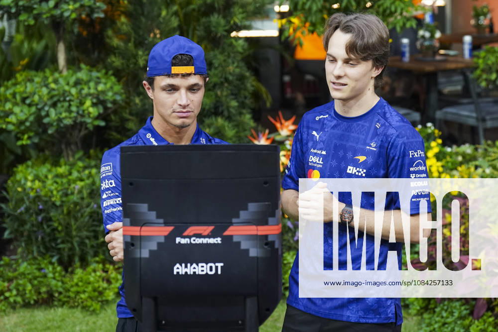 FORMULA 1 SINGAPORE AIRLINES SINGAPORE GRAND PRIX 2026 Lando Norris (GBR) 1 McLaren and Oscar Piastri (AUS) 81 McLaren greeting fans via robot in the paddock during the Formula 1 Singapore Airlines Singapore Grand Prix 2026, Round 17 of the 2026 Formula 1 World Championship, WM, Weltmeisterschaft from 9th - 11th October 2026 at the Marina Bay Street Circuit, Singapore. Credit: Robbie Hoad Every Second Media Editorial use only. All images are copyright Every Second Media Limited. No images may be reproduced without prior permission.