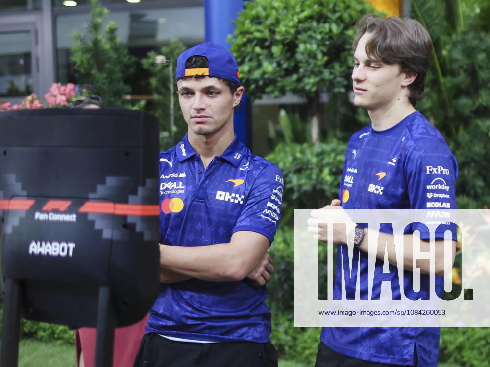 LANDO NORRIS and OSCAR PIASTRI of McLaren Mastercard F1 Team interact with children during a video call in the team s hospitality area in the paddock ahead of the 2026 Formula 1 Singapore Grand Prix at Marina Bay Street Circuit in Singapore. 2026 Singapore Grand Prix - ZUMAh201 20261008_zsp_h201_035