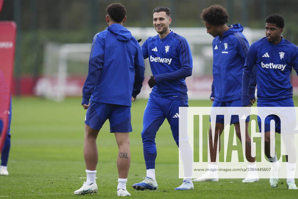 Manchester United, ManU Training, Champions League Diogo Dalot of Manchester United jokes with Matheus Cunha of Manchester United during the Manchester United Training Session at Carrington Training Centre, ahead of the UEFA Champions League Matchday 2 v Atletico Madrid, Manchester, England on 12 October 2026 Credit: Steve Flynn Every Second Media Editorial use only. All images are copyright Every Second Media Limited. No images may be reproduced without prior permission.