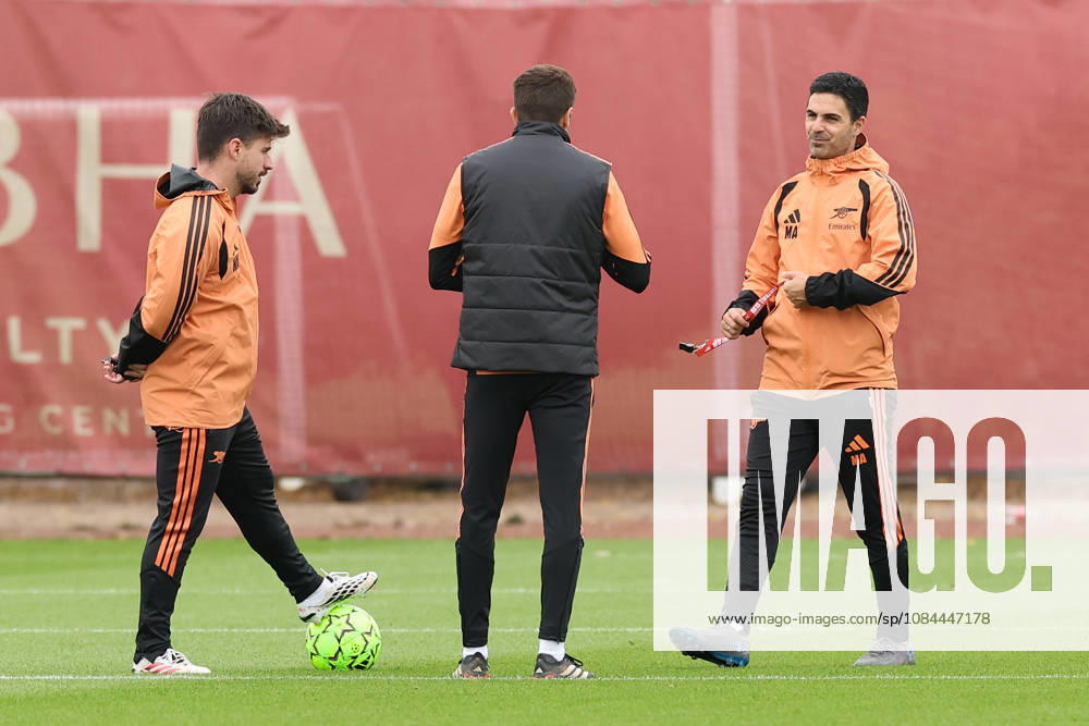 Arsenal Training & Media Conference, Champions League Arsenal Manager, Mikel Arteta (right) speaks with his coaching staff during the Arsenal training session at the Arsenal FC Training Centre, ahead of UEFA Champions League Matchday 2 v Lille, London Colney, England on 12 October 2026 Credit: Tiego Grenho Every Second Media Editorial use only. All images are copyright Every Second Media Limited. No images may be reproduced without prior permission.