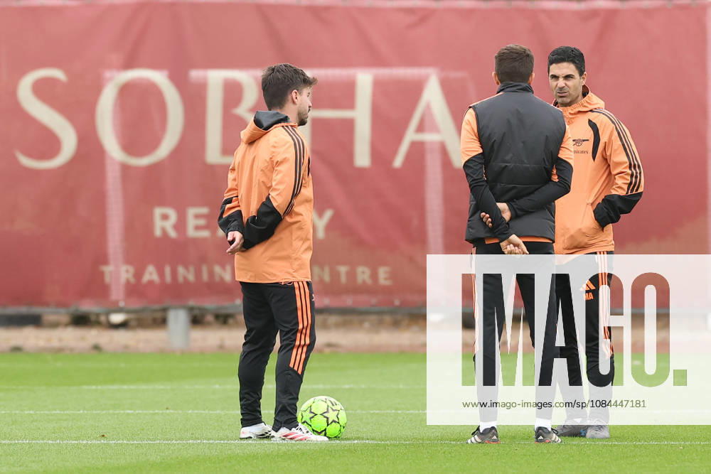 Arsenal Training & Media Conference, Champions League Arsenal Manager, Mikel Arteta (right) speaks with his coaching staff during the Arsenal training session media conference at the Arsenal FC Training Centre, ahead of UEFA Champions League Matchday 2 v Lille, London Colney, England on 12 October 2026 Credit: Tiego Grenho Every Second Media Editorial use only. All images are copyright Every Second Media Limited. No images may be reproduced without prior permission.