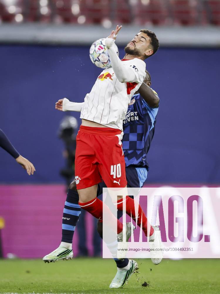 LEIPZIG - (lr) RÃ mulo Cardoso of RB Leipzig and Lutsharel Geertruida of PSV Eindhoven jump for the ball during the UEFA Champions League match between RB Leipzig and PSV Eindhoven at the RB Arena on October 13, 2026 in Leipzig, Germany. MAURICE VAN STEEN ANP ANPxSportx IVx 572346053 originalFilename: 572346053