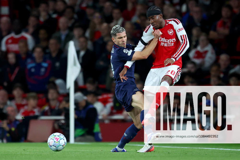 Arsenal FC v LOSC Lille - UEFA Champions League 2026 27 League Phase MD2 Romain Perraud of LOSC Lille and Noni Madueke of Arsenal challenge during the UEFA Champions League 2026 27 League Phase MD2 match between Arsenal FC and LOSC Lille at Arsenal Stadium on October 13, 2026 in London, England. London Arsenal Stadium England United Kingdom