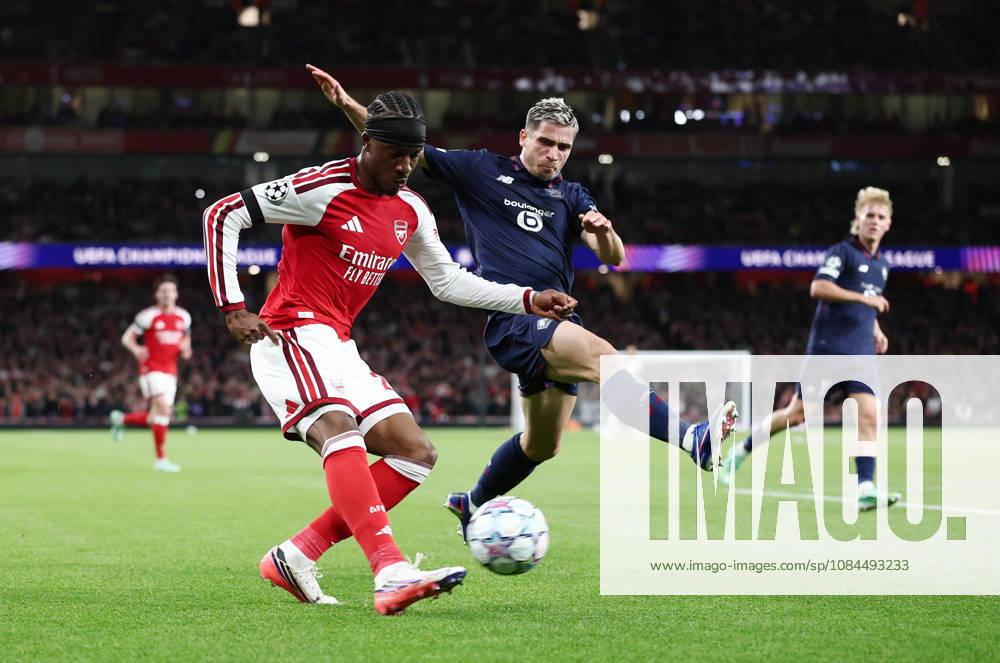 London, England, 13th October 2026. Noni Madueke of Arsenal and Romain Perraud of LOSC Lille during the Arsenal vs LOSC Lille UEFA Champions League match at the Emirates Stadium, London. Picture credit should read: David Klein Sportimage . SPI_032_DK_Arsenal_Lille SPI-5065-0033