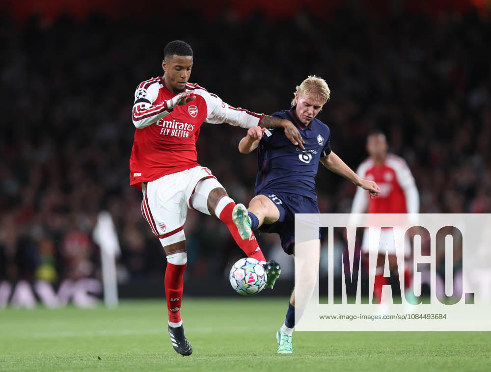 London, England, 13th October 2026. Ezri Konsa of Arsenal tussles with Hakon Arnar Haraldsson of LOSC Lille during the Arsenal vs LOSC Lille UEFA Champions League match at the Emirates Stadium, London. Picture credit should read: David Klein Sportimage . SPI_033_DK_Arsenal_Lille SPI-5065-0034