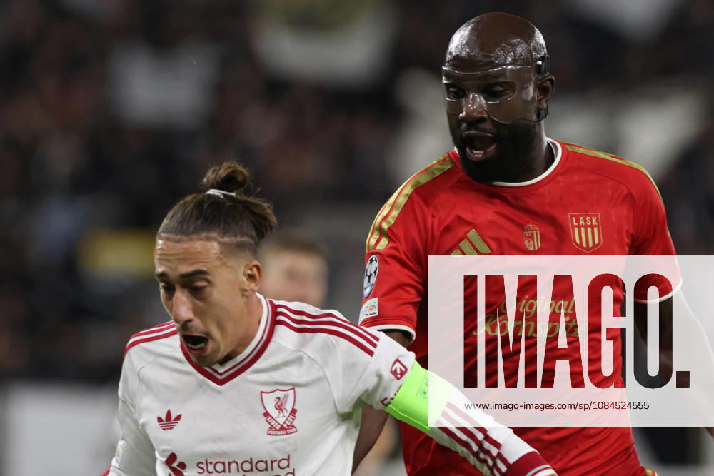 Kostas Tsimikas of Liverpool and Samuel Adeniran of LASK during the UEFA Champions League league phase matchday 2 match between LASK and Liverpool at Oberoesterreich Arena on October 14, 2026 in Linz, Austria. (Photo by Severin Aichbauer Sports Press Photo SPP)