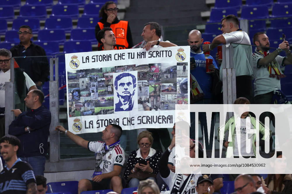 SOCCER - UEFA Champions League - AS Roma vs. Real Madrid Photo by IPA ABACAPRESS.COM89686137 - Rome, Italy — October 14, 2026: A Real Madrid fan in the stands holding a Mourinho banner and Lazio flags during the 2026–2027 UEFA Champions League soccer match between AS Roma and Real Madrid CF at the Olympic Stadium in Rome. Rome Italy