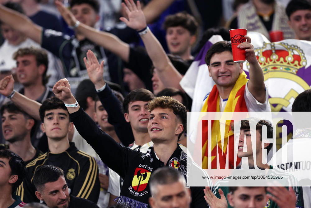 SOCCER - UEFA Champions League - AS Roma vs. Real Madrid Photo by IPA ABACAPRESS.COM89686139 - Rome, Italy — October 14, 2026: A Real Madrid fan in the stands holding a Mourinho banner and Lazio flags during the 2026–2027 UEFA Champions League soccer match between AS Roma and Real Madrid CF at the Olympic Stadium in Rome. Rome Italy