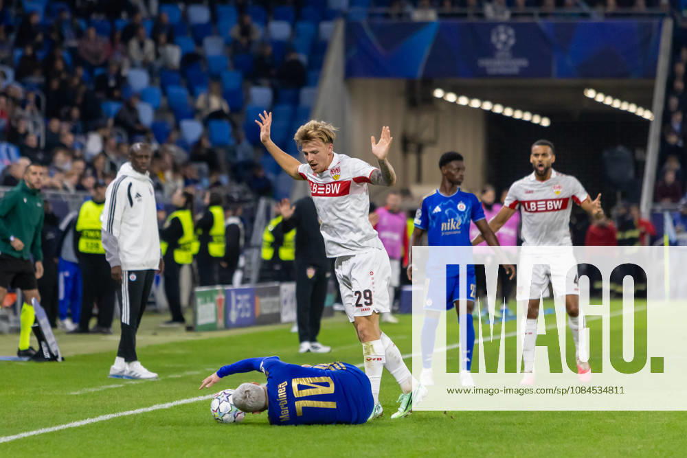 Cristian Martinez of SK Slovan Bratislava and Finn Jeltsch of VfB Stuttgart seen during UEFA Champions league League phase game between teams of SK Slovan Bratislava and VfB Stuttgart (Dominika Kortvelyesiova Ball Raw Images) Bratislava Tehelne Pole stadium Slovakia