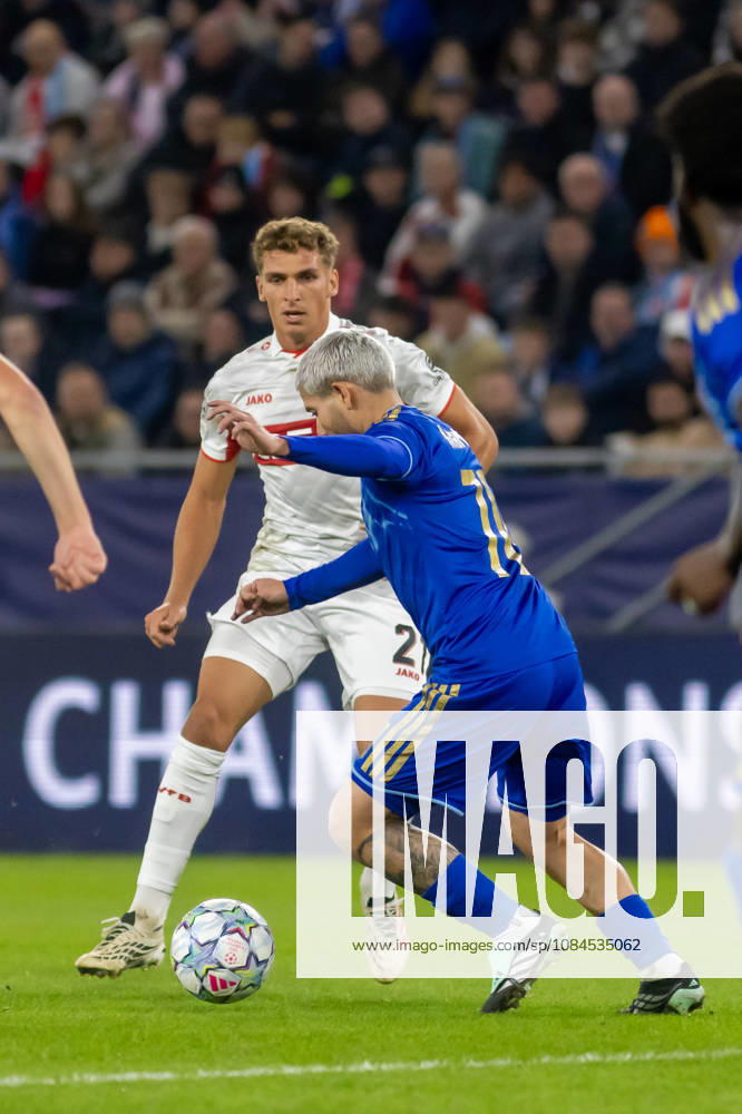 Grischa Promel of VfB Stuttgart and Cristian Martinez of SK Slovan Bratislava seen during UEFA Champions league League phase game between teams of SK Slovan Bratislava and VfB Stuttgart (Dominika Kortvelyesiova Ball Raw Images) Bratislava Tehelne Pole stadium Slovakia