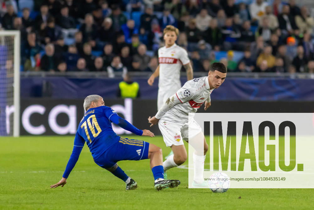 Cristian Martinez of SK Slovan Bratislava and Dženan PejÄinovic of VfB Stuttgart seen during UEFA Champions league League phase game between teams of SK Slovan Bratislava and VfB Stuttgart (Dominika Kortvelyesiova Ball Raw Images) Bratislava Tehelne Pole stadium Slovakia